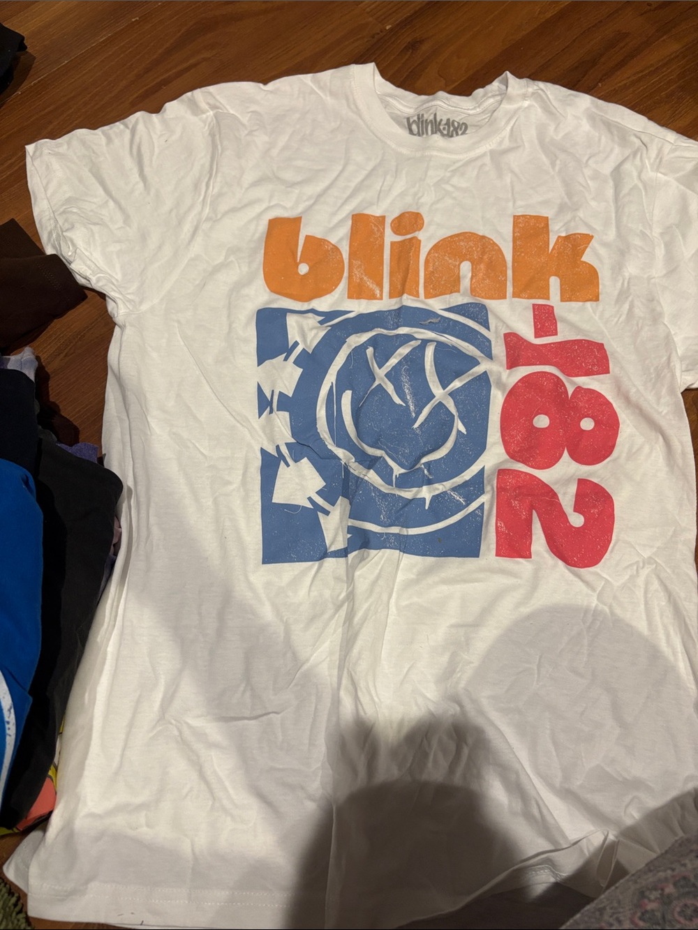 Blink 182 Graphic Tee - White with Orange, Blue & Red Print